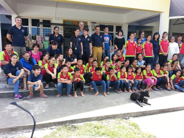 The outreach team in a group photo with some of the children at the hostel in Toboh, Tambunan on July 19 2014.